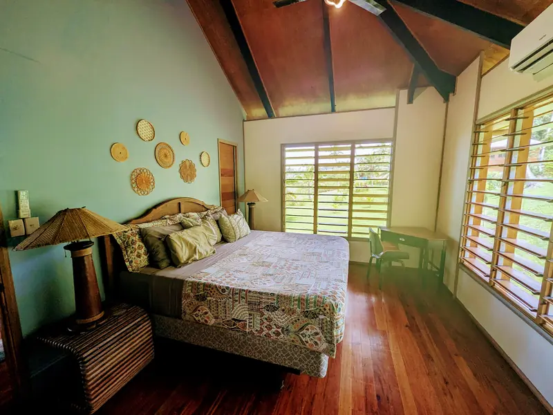 Bright bedroom with woven wall decorations